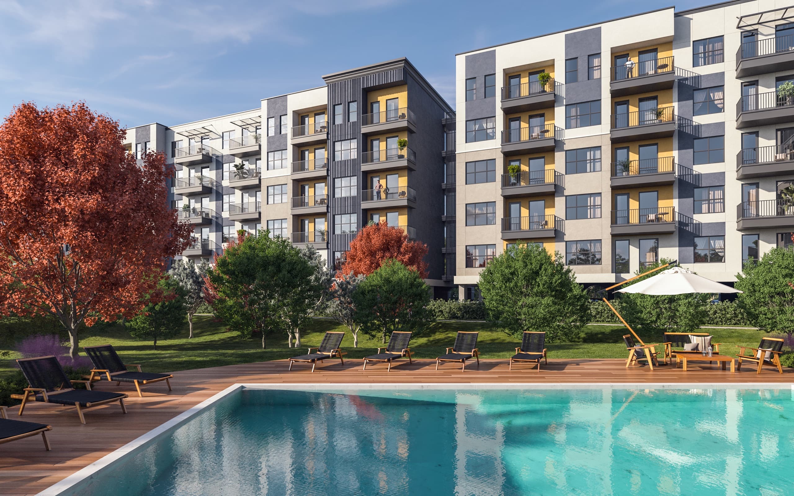 Piscina principal com deck e paisagismo